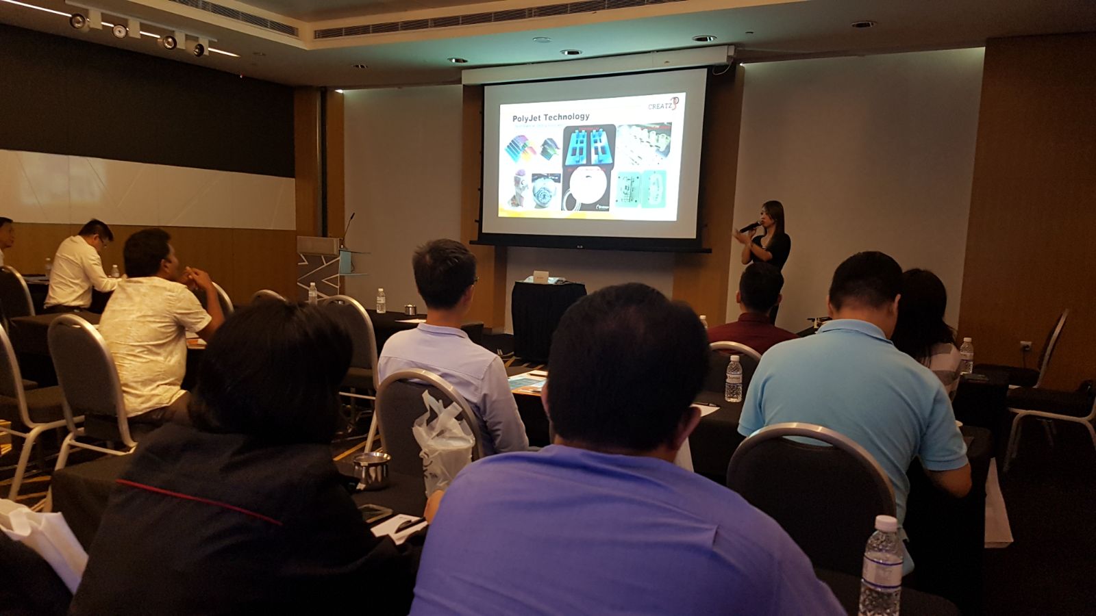 Ms. Sally Chuen presenting on how Additive Manufacturing has moved beyond prototyping