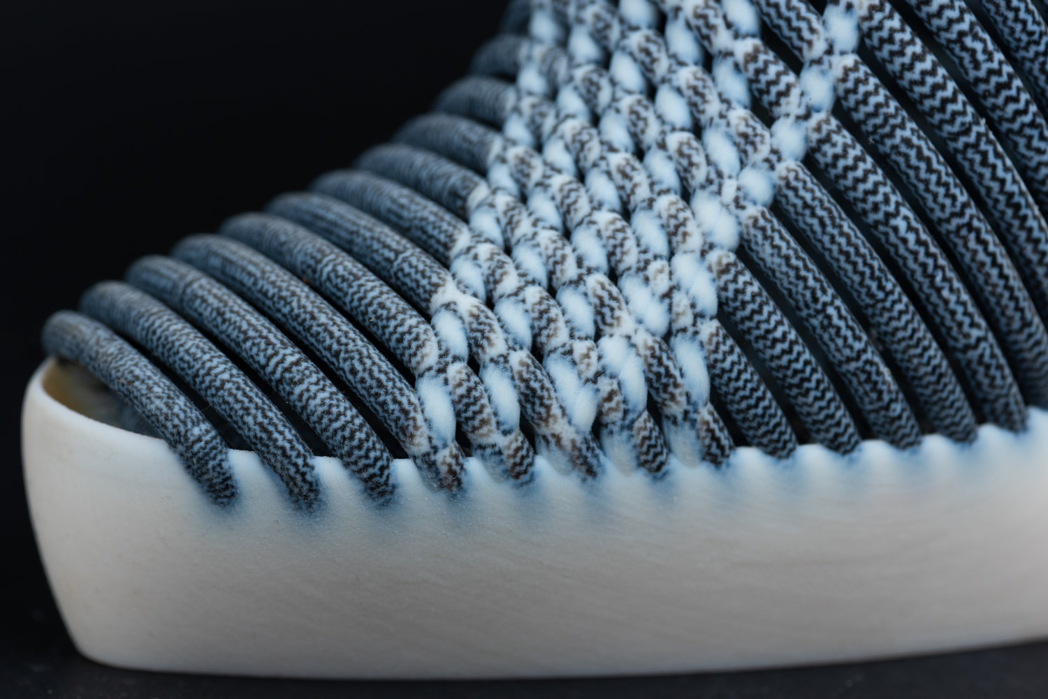 Details of the shoe made by combining 3D printing and ikat weaving.