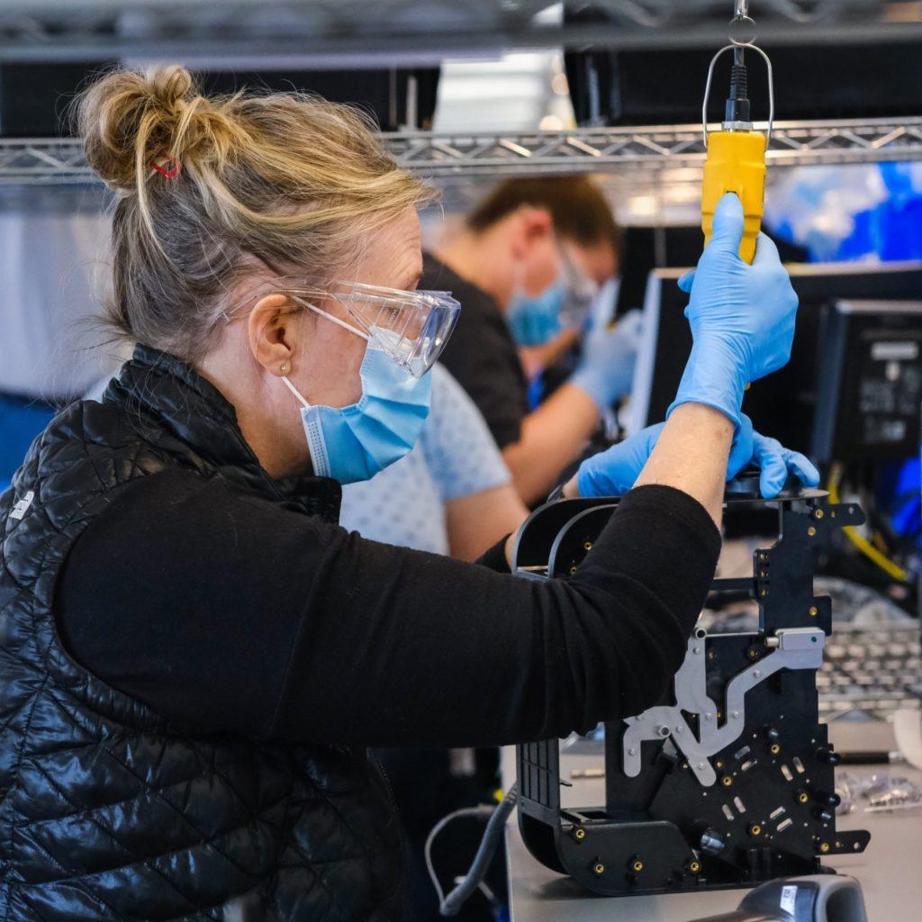 Workers build production ventilators at the General Motors manufacturing facility in Kokomo, Indiana, Tuesday, April 28, 2020. GM and Ventec Life Systems are partnering to produce VOCSN critical care ventilators in response to the COVID-19 pandemic. (Photo by AJ Mast for General Motors)