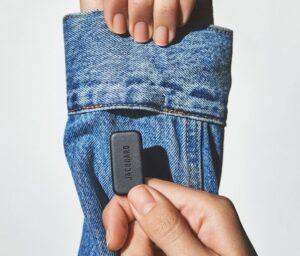The Jacquard tag inserted into the sleeve of a denim jacket.